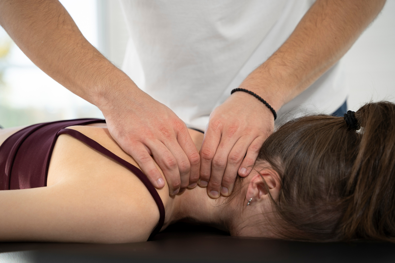 chiropractic doctor working on neck